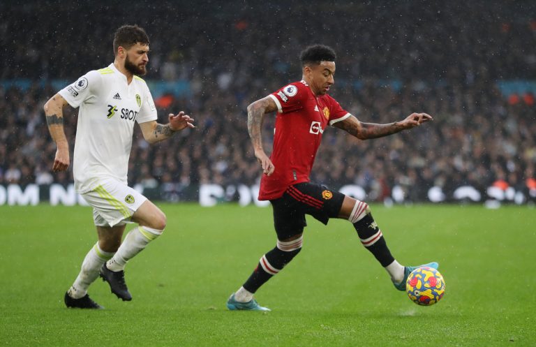 Mateusz Klich and Jesse Lingard battle for the ball