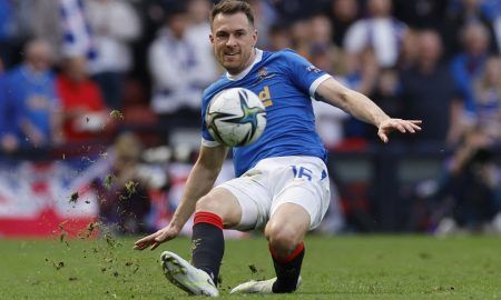 Rangers midfielder Aaron Ramsey passes the ball