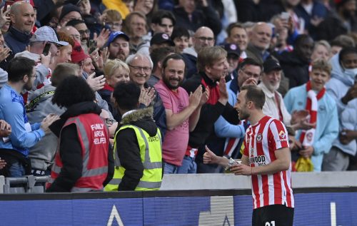 Brentford star Christian Eriksen greets Tottenham supporters