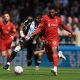 Liverpool defender Joe Gomez battles for the ball