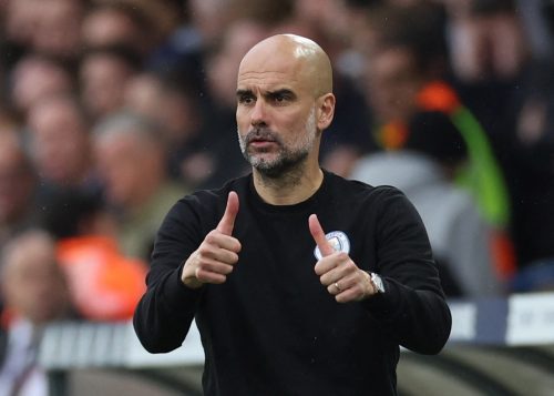 Man City boss Pep Guardiola signals
