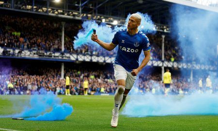 Everton's Richarlison celebrates with a flare