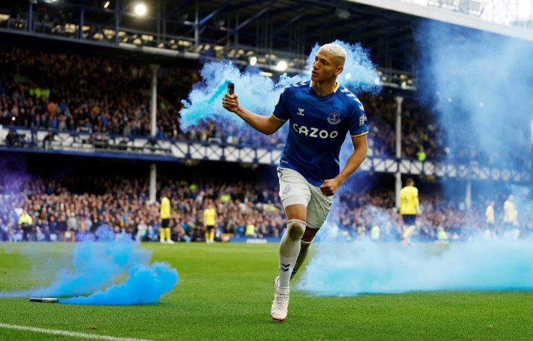 Everton's Richarlison celebrates with a flare