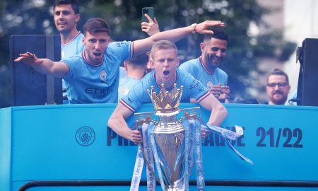 Man City's Oleksandr Zinchenko celebrates with the Premier League trophy