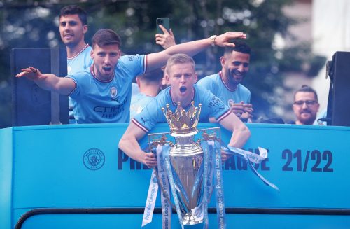 Man City's Oleksandr Zinchenko celebrates with the Premier League trophy