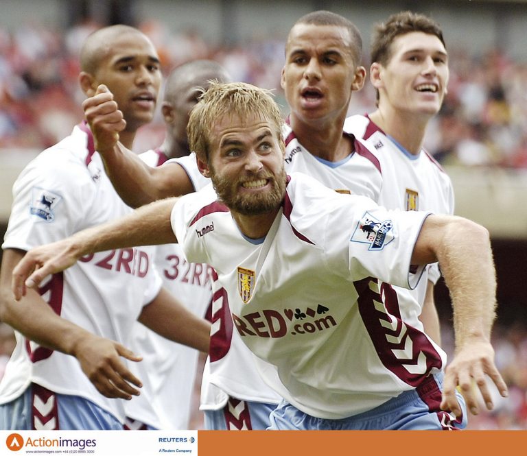 Olof Mellberg celebrates scoring for Aston Villa