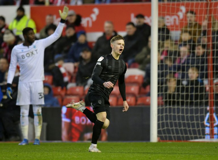 Keane Lewis-Potter celebrates