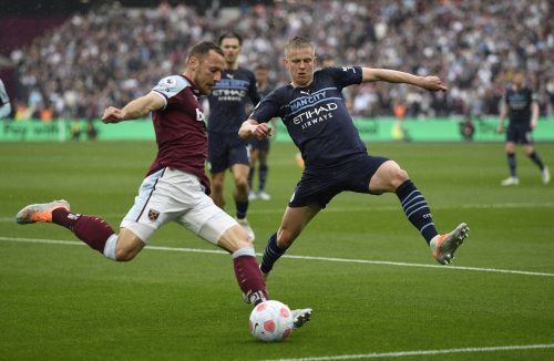 Oleksandr Zinchenko attempts to block a cross