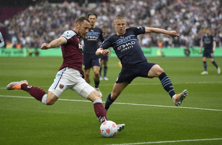 Oleksandr Zinchenko attempts to block a cross