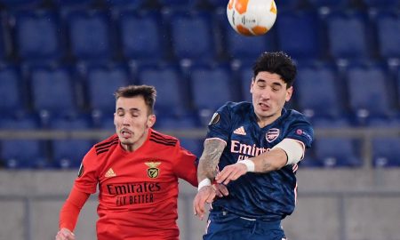 Arsenal's Hector Bellerin challenges for a header