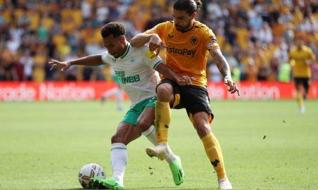 Wolves' Ruben Neves challenges Jacob Murphy for possession