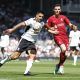 Liverpool's Andy Robertson in action with Aleksandar Mitrovic