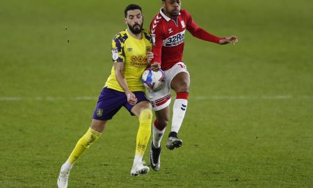 Middlesbrough's Chuba Akpom in action with Huddersfield Town's Alejandro Vallejo