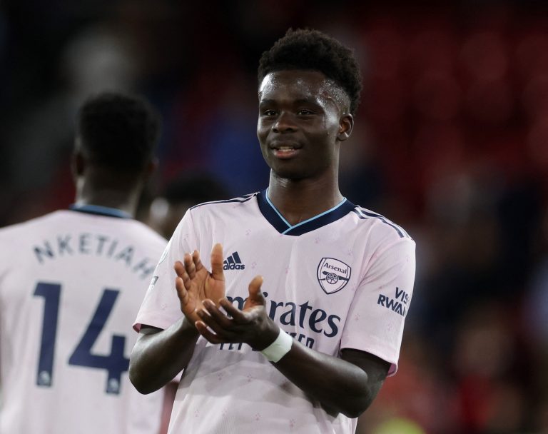 Arsenal's Bukayo Saka applauds fans after the match