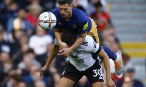 Newcastle's Fabian Schar gets above Carlos Vinicius