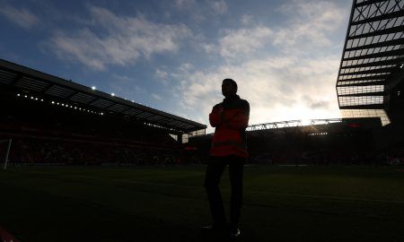 Liverpool's home stadium Anfield in silhouette