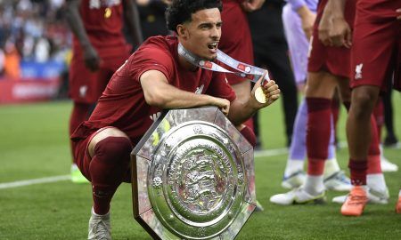 Curtis-Jones-celebrates-with-the-trophy-for-Liverpool