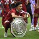 Curtis-Jones-celebrates-with-the-trophy-for-Liverpool