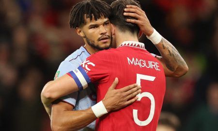 Aston Villa's Tyrone Mings embraces Harry Maguire