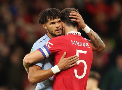 Aston Villa's Tyrone Mings embraces Harry Maguire