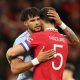 Aston Villa's Tyrone Mings embraces Harry Maguire