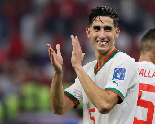 Morocco's Nayef Aguerd applauds fans after the match