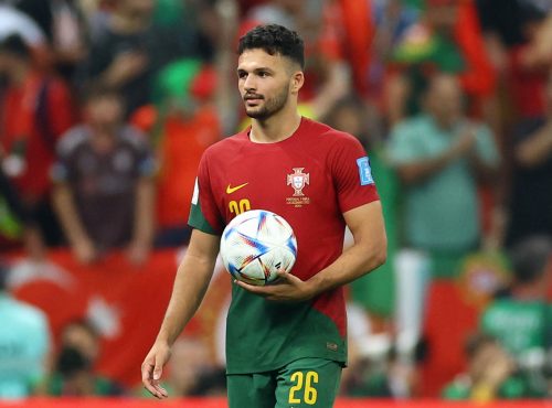 Portugal's Goncalo Ramos celebrates after the match as he holds the match ball at full time after scoring a hat-trick