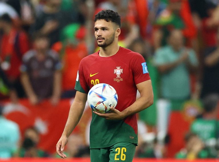 Portugal's Goncalo Ramos celebrates after the match as he holds the match ball at full time after scoring a hat-trick