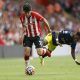 Southampton's Tino Livramento in action with Manchester United's Fred