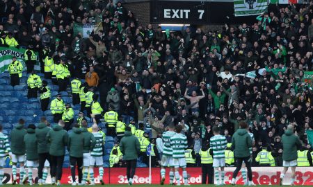 Celtic players applaud fans after the match