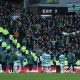 Celtic players applaud fans after the match