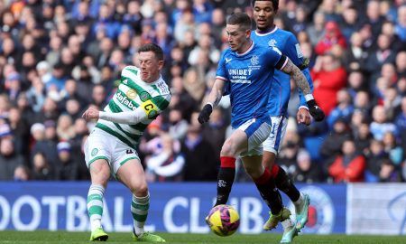 Celtic's Callum McGregor in action with Rangers' Ryan Kent