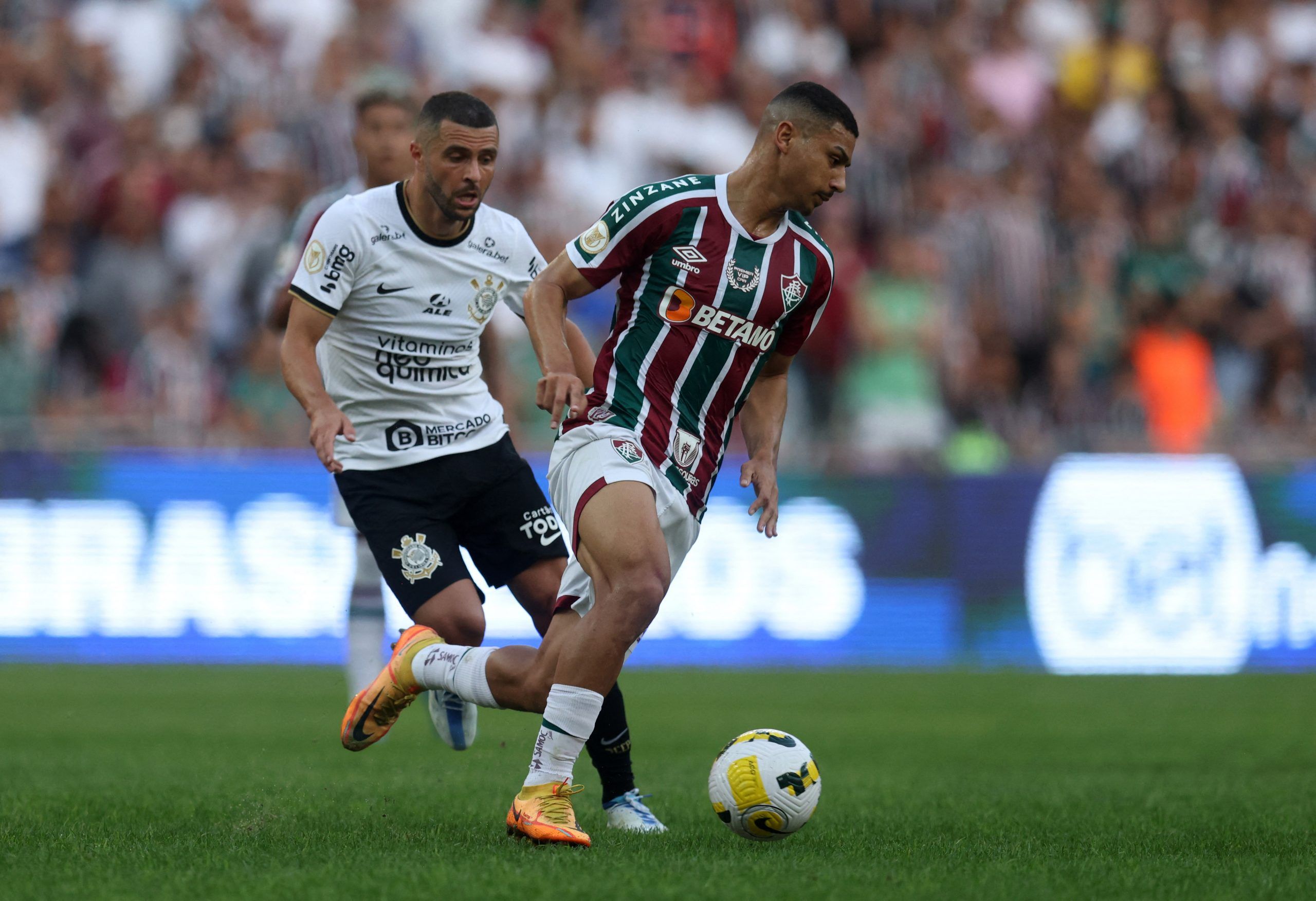 Fluminense's Andre in action with Corinthians' Moraes