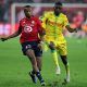Lille's Tiago Djalo in action with Nantes' Randal Kolo Muani