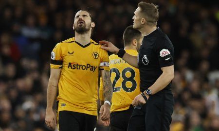 Wolverhampton Wanderers' Ruben Neves reacts after being shown a yellow card