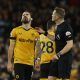 Wolverhampton Wanderers' Ruben Neves reacts after being shown a yellow card