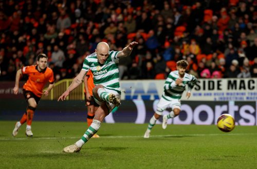 Celtic's Aaron Mooy scores their second goal from the penalty spot