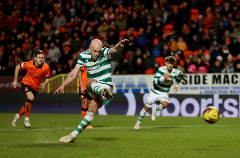 Celtic's Aaron Mooy scores their second goal from the penalty spot