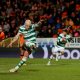 Celtic's Aaron Mooy scores their second goal from the penalty spot