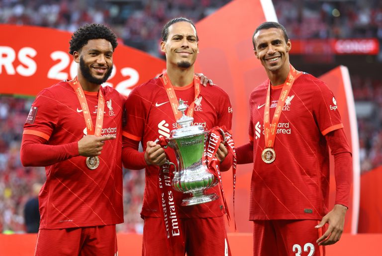 Liverpool's Virgil van Dijk, Joel Matip and Joe Gomez celebrate with the trophy after winning the FA Cup final