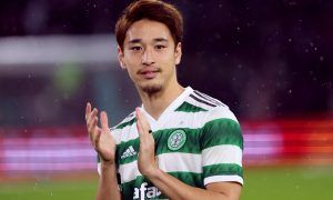 New Celtic signing Yuki Kobayashi applauds fans before the match