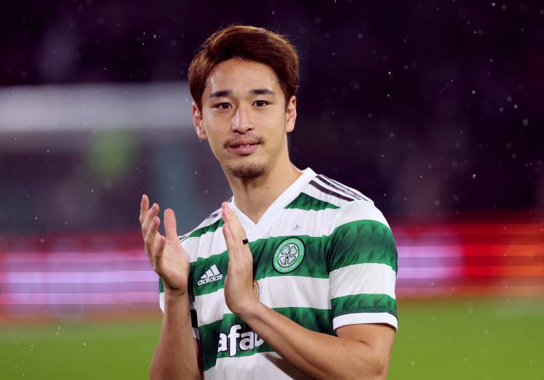 New Celtic signing Yuki Kobayashi applauds fans before the match