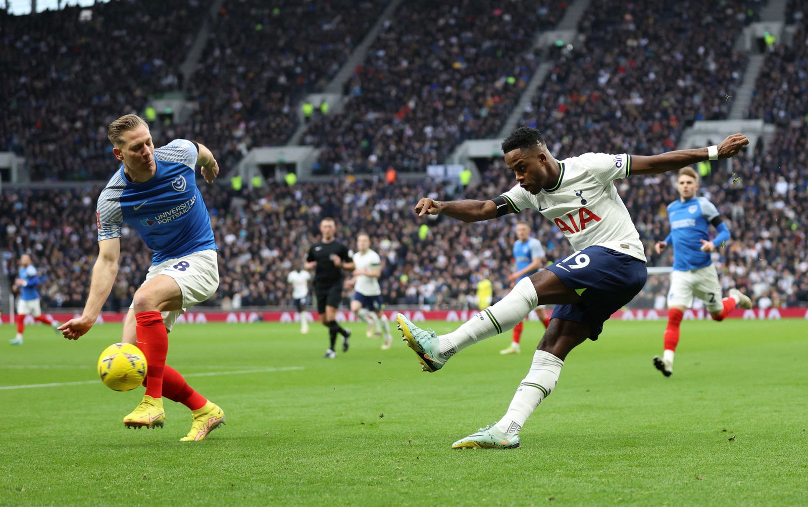 Portsmouth's Michael Morrison in action with Tottenham Hotspur's Ryan Sessegnon