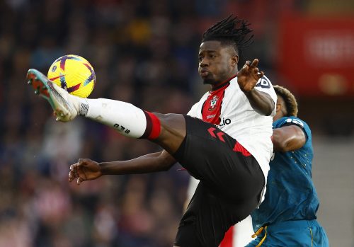 Southampton's Mohammed Salisu in action with Wolverhampton Wanderers' Adama Traore