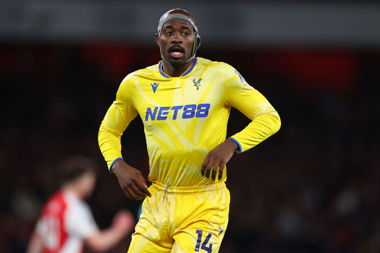 Soccer plaayer in headband.