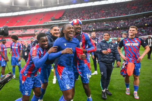 Soccer players celebrate.
