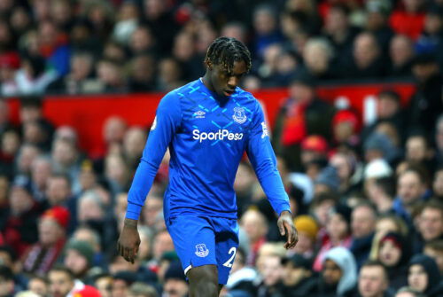 Soccer player in blue shirt looks dejected.