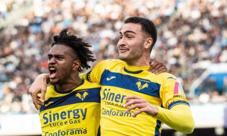 Soccer players celebrate goal.