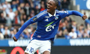 Soccer player in blue jersey.