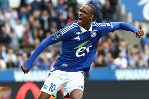 Soccer player in blue jersey.